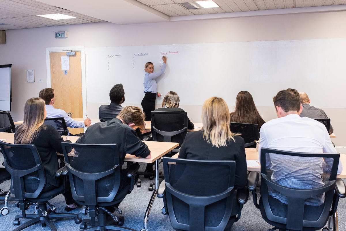full training rooms set in classroom layout with instructor using wall talker